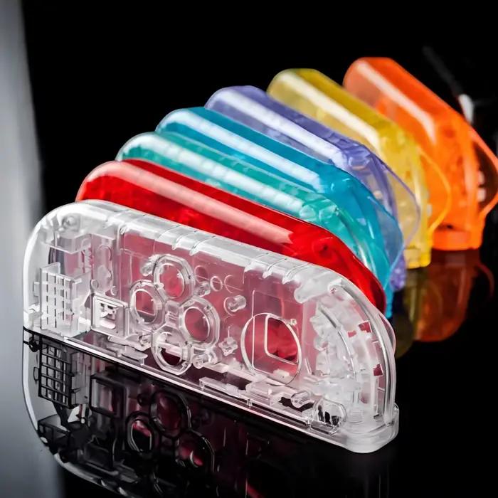 Coque transparente pour manette de commutation